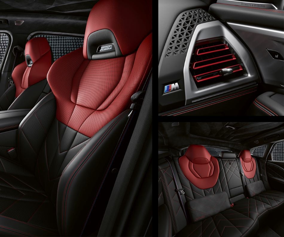 Detail of front seats, clad in exclusive BMW Individual Fiona Red & Black Merino Leather with exclusive M Signature Trim and red stitching and accents. Detail of red accented vent. Detail of rear M Lounge with exclusive XM pillows in BMW of Tuscaloosa | Tuscaloosa AL